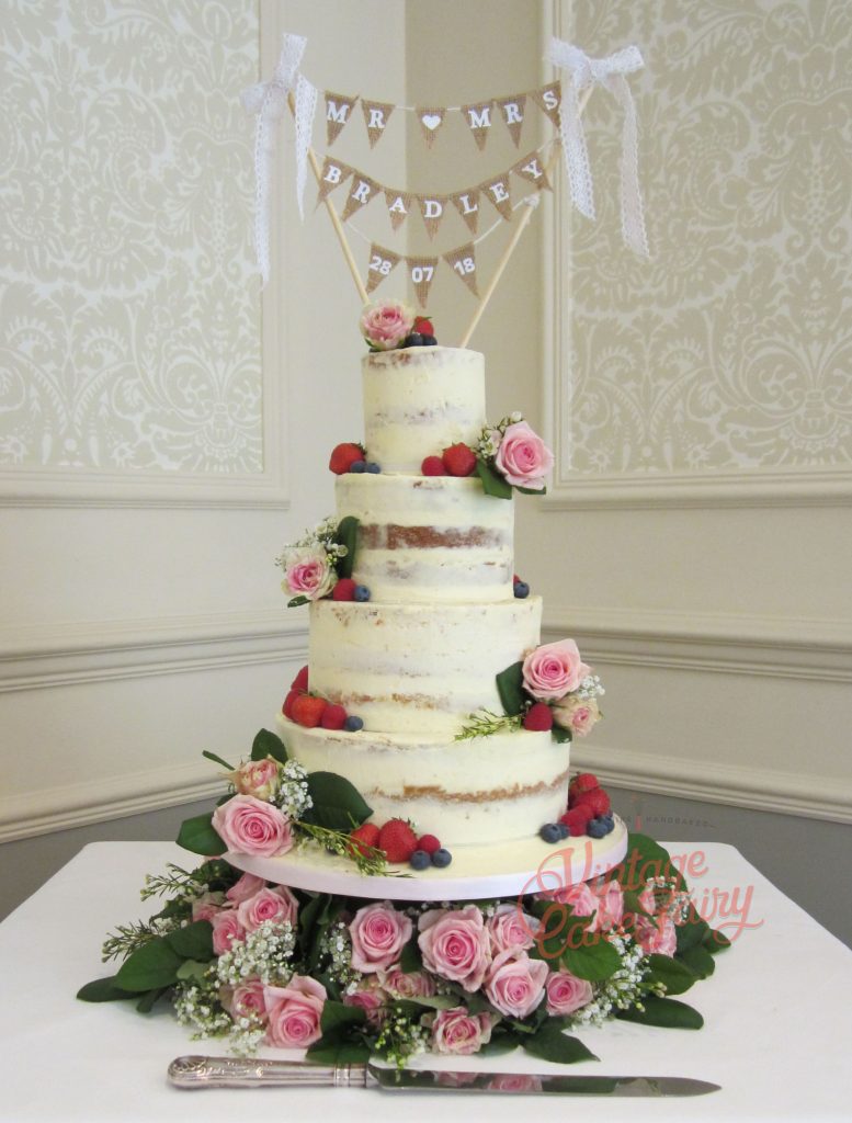 tall and narrow five tier wedding cake, ombre purple with sugar roses and sweetpeas 
